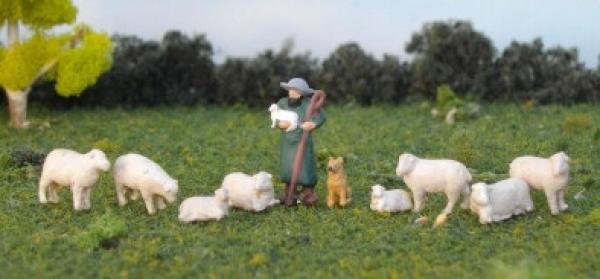 Schäfer mit Hund und Schäfchen
