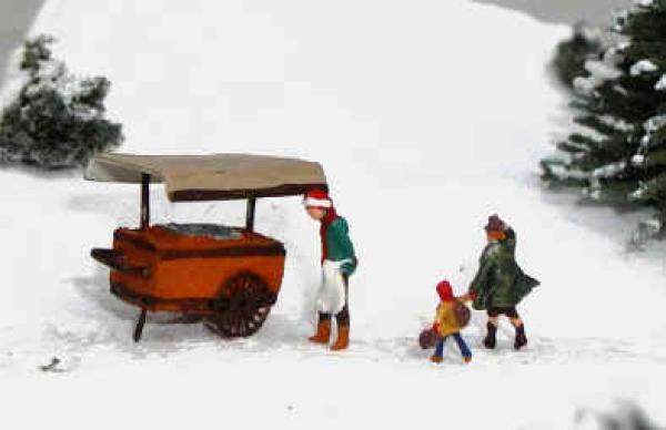 Maroniverkäufer mit Kundschaft